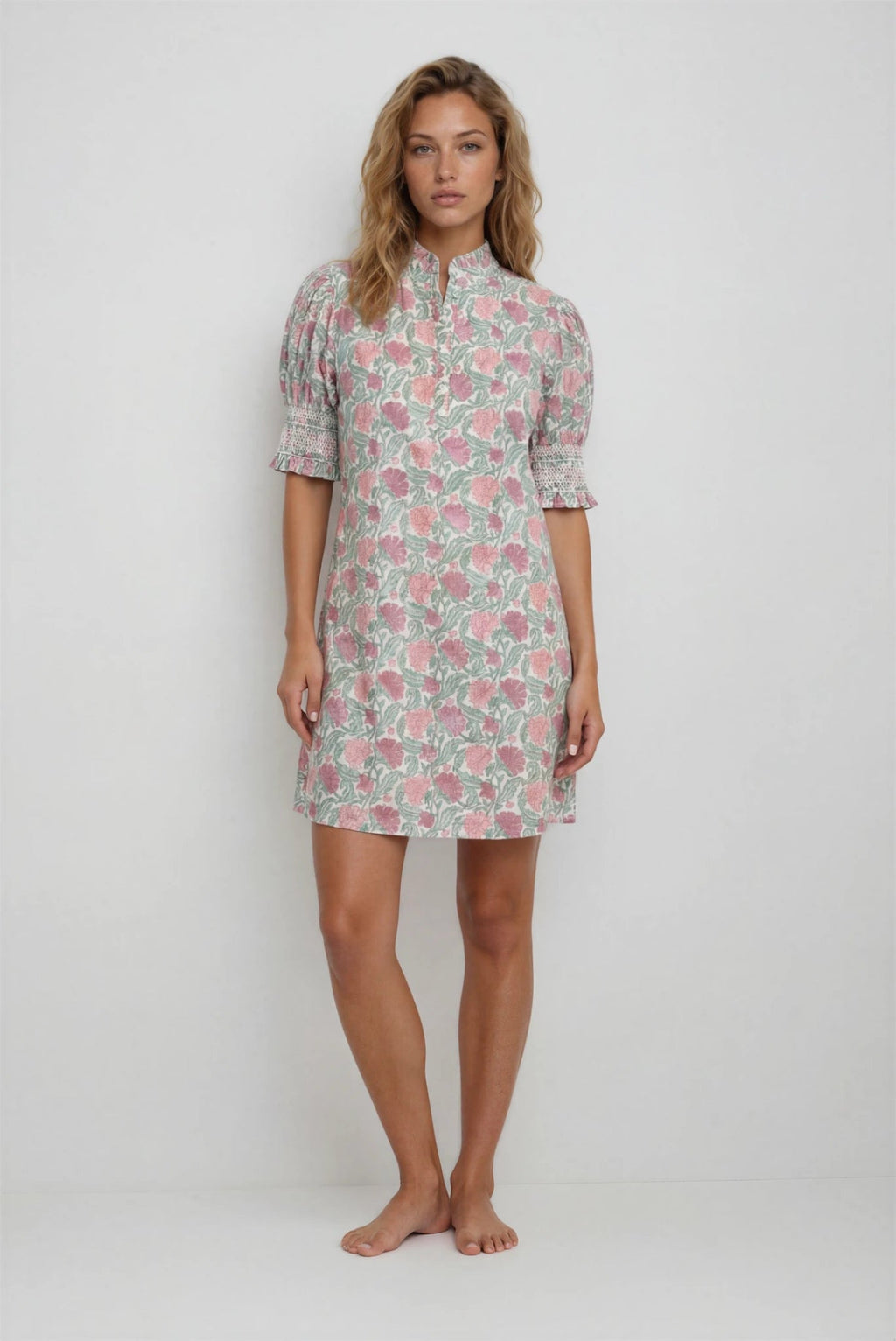 Woman wearing a floral dress on a white background
