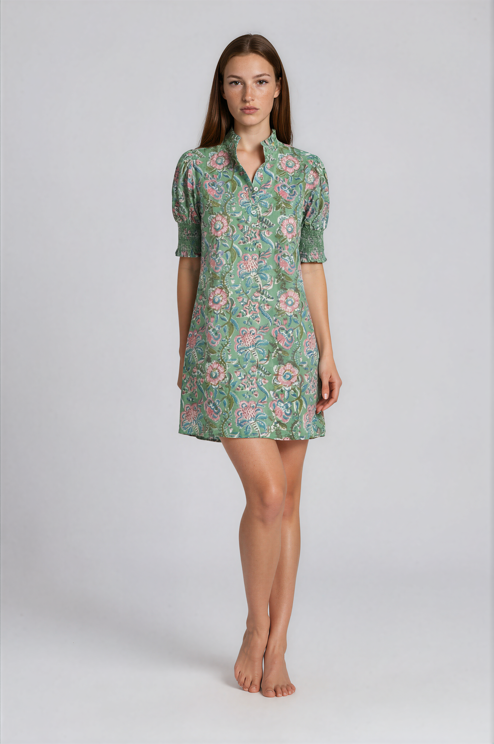 Woman wearing a floral dress on a white background