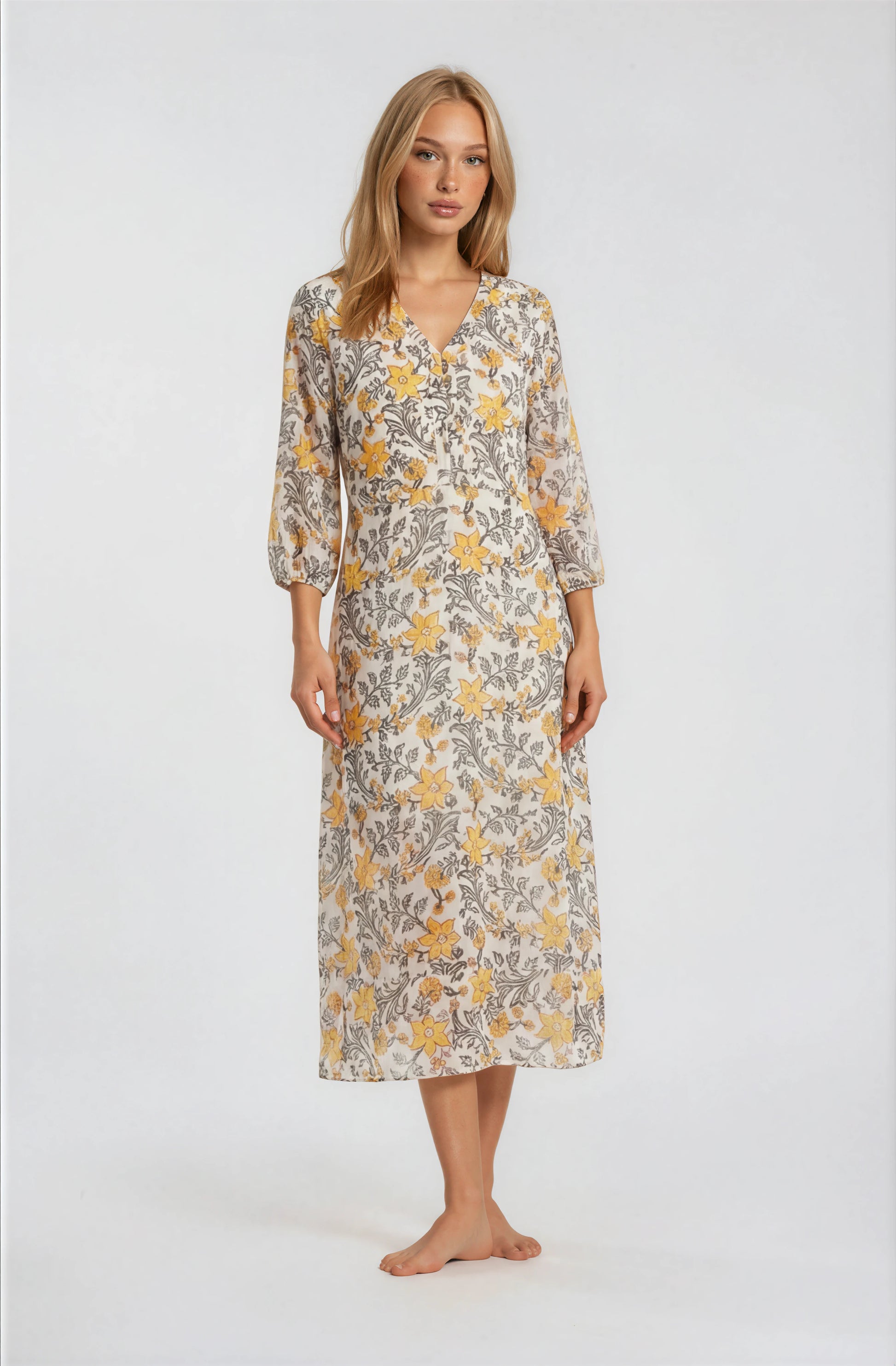 Woman wearing a floral dress on a white background
