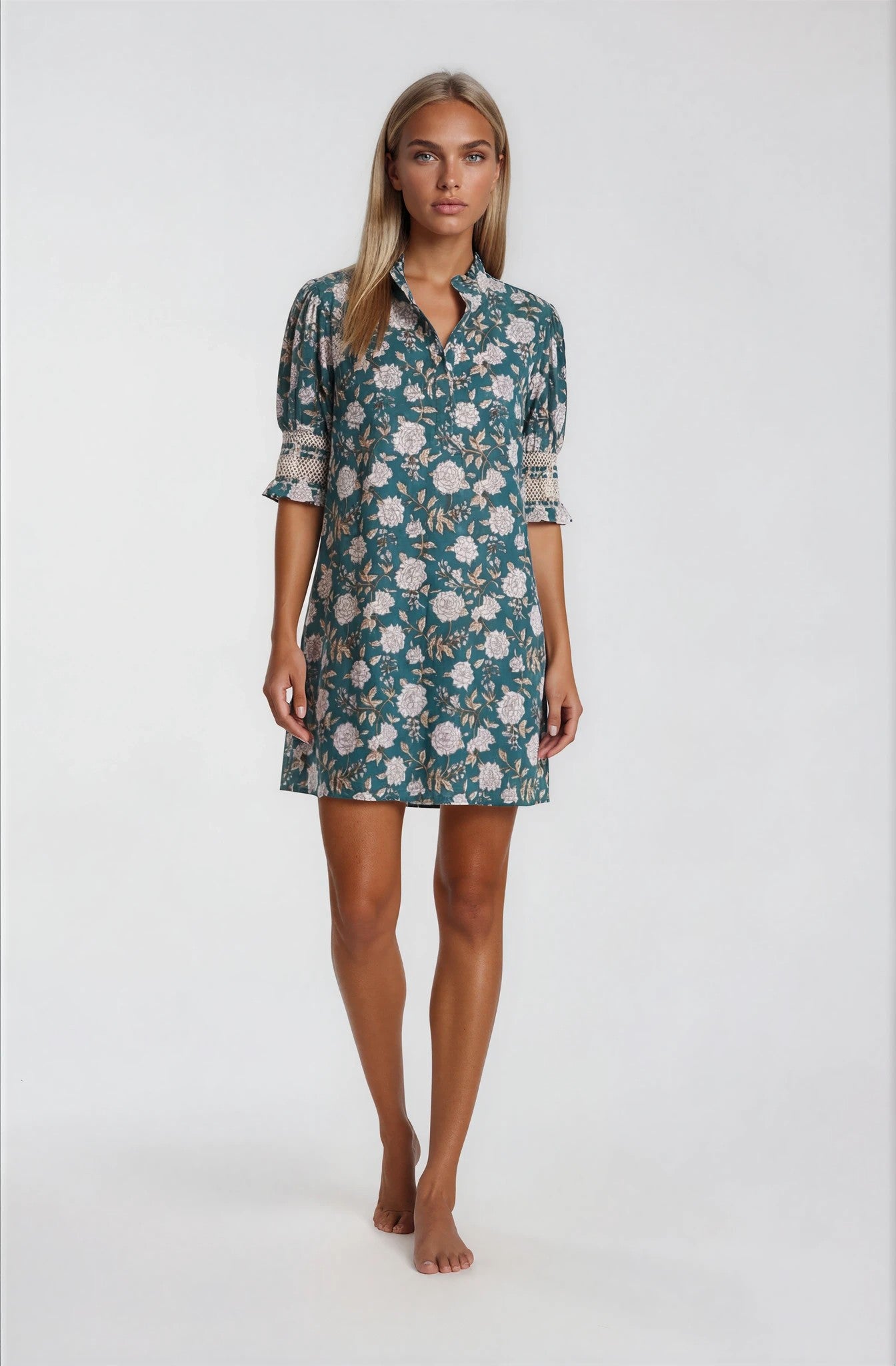 Woman wearing a floral dress on a white background