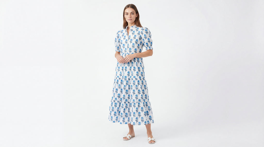 Woman wearing a blue floral dress on a white background
