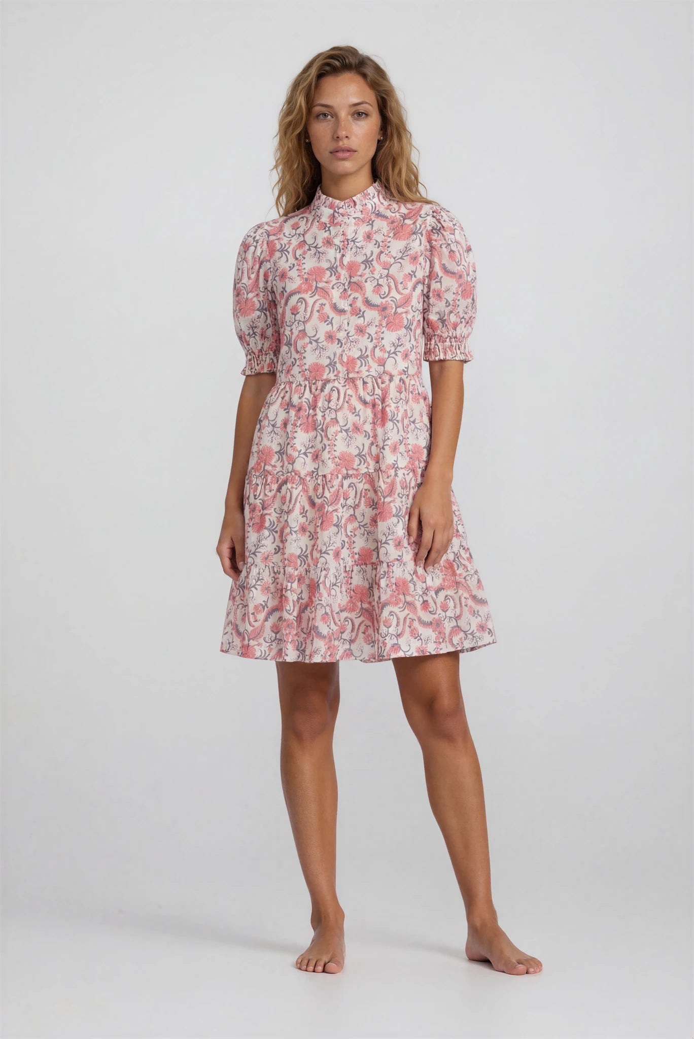 Woman wearing a floral dress on a white background