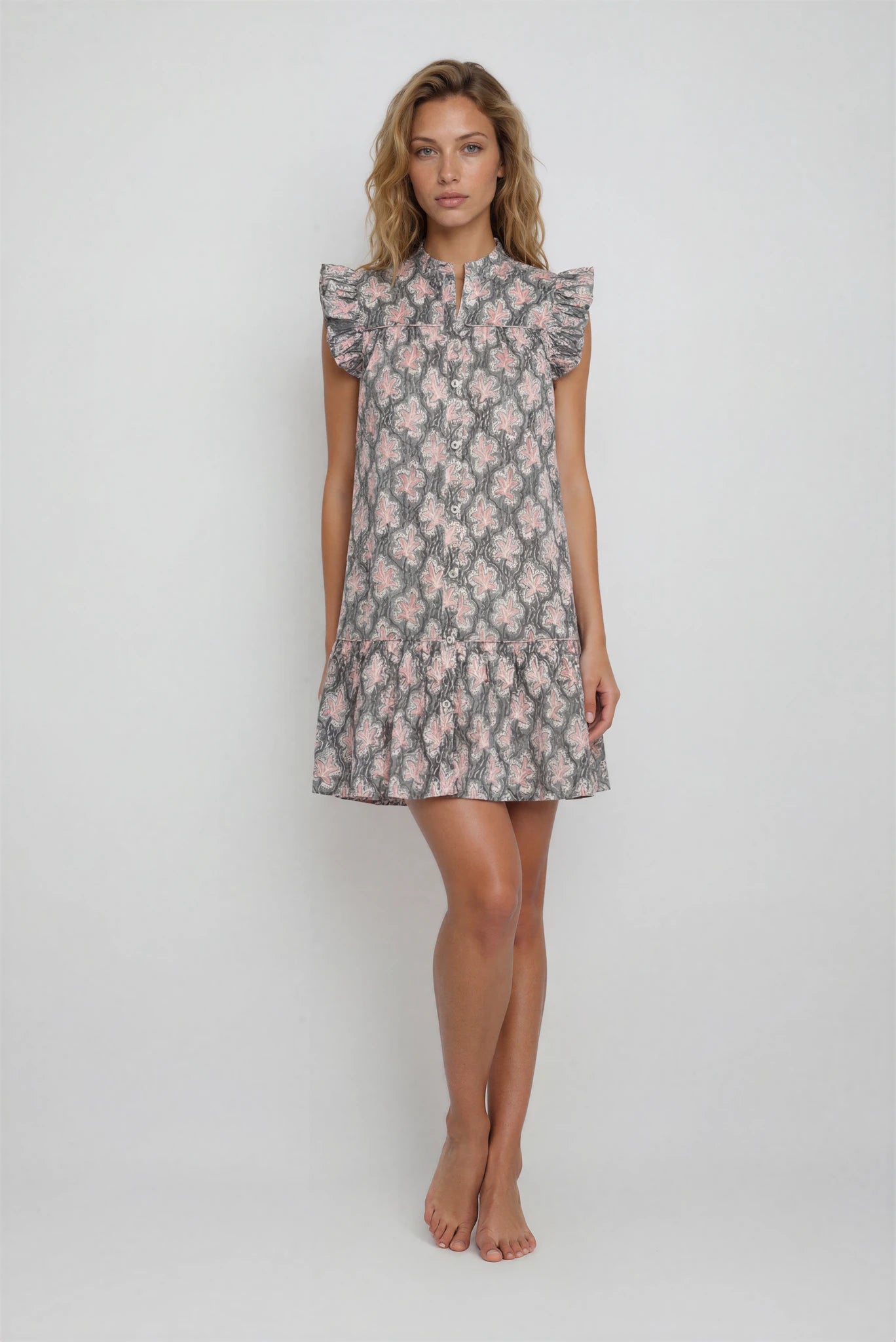 Woman wearing a floral dress on a white background