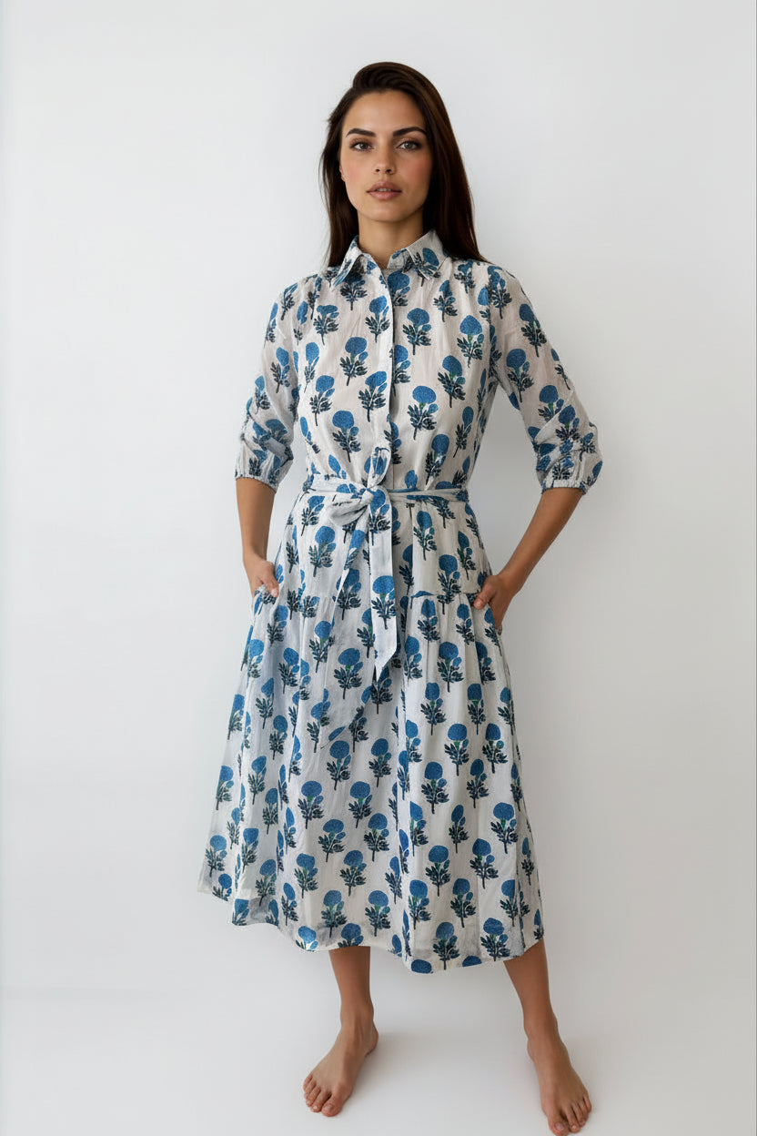 Woman wearing a floral dress against a white background